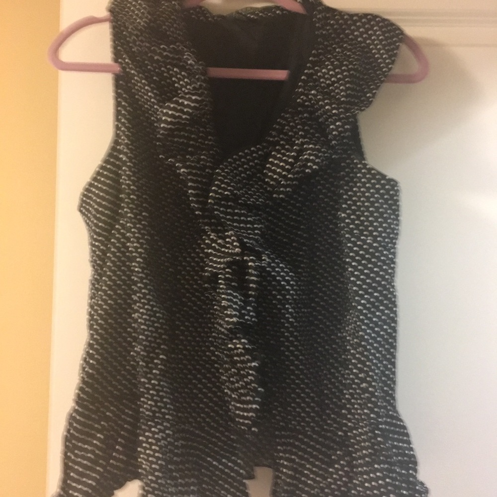 Black and white sleeveless ruffle top.